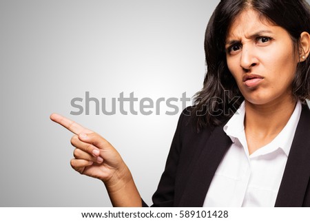 latin business woman pointing space