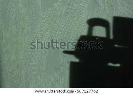 Car cockpit shade, shadow on the wall, subject shadow on the wall, shadow wallpaper, shadow.Light falls on a subject and creates shadows on the wallpaper in the room. Object boundary, light and shade.