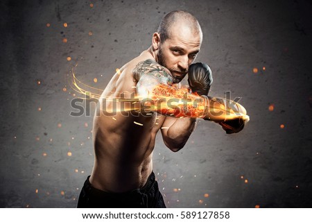 Conceptual Portrait of brutal boxer in fire sparks and smoke. Art Sport background. Royalty-Free Stock Photo #589127858