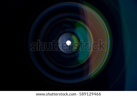 The diaphragm of a camera lens aperture.