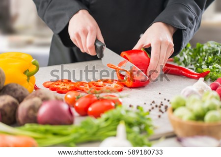 chef cooking food kitchen restaurant cutting prepare cook hands healthy hotel man male knife preparation fresh preparing young natural culinary domestic desktop dietary red concept - stock image 