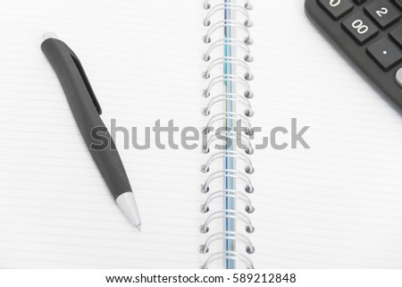 Business concept with calculator, pen and notebook, start-up business