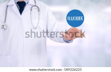FLUORIDE Medicine doctor hand working Professional doctor use computer and medical equipment all around