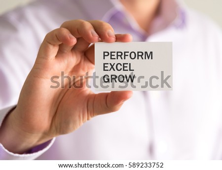 Closeup on businessman holding a card with PERFORM EXCEL GROW message, business concept image with soft focus background and vintage tone