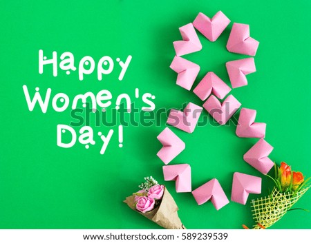 Happy International Women’s Day celebrate on March 8 CARD. rose-color paper hearts shape figure eight 8 on color background
