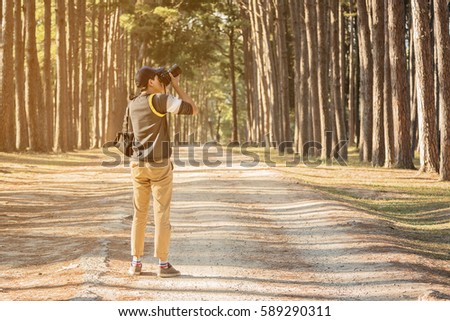 Nature photographer taking photos in the jungle