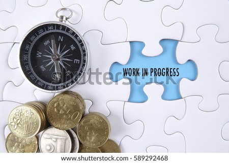 Missing piece of puzzle, compass and coins on white background with conceptual text.