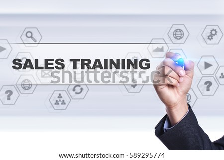 Businessman drawing on virtual screen. sales training concept.
