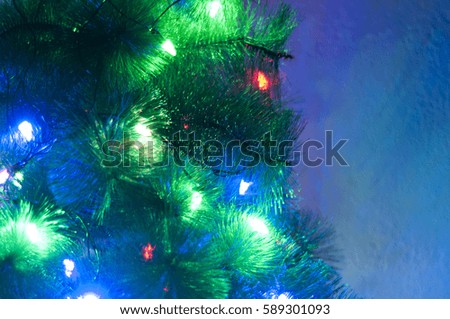 The branches of Christmas trees in flames garland