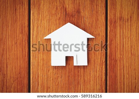 house symbol with wood background