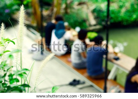 Meet and greet or Wait a moment here or Negotiations in the coffee shop with green garden and river background 