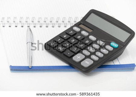 Photo of the Business concept with calculator, pen and notebook