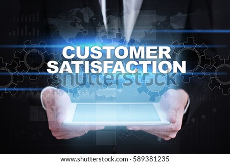 Businessman holding tablet PC with customer satisfaction concept.