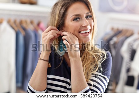 Picture showing happy woman shopping for clothes