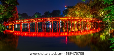 The Huc bridge (red bridge), entrance of Ngoc Son temple on Hoan Kiem lake, Hanoi, Vietnam Royalty-Free Stock Photo #589475708