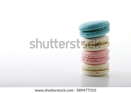 Sweet and colourful french macaroons on white background