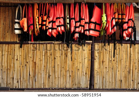 Bamboo wall hanging a life jacket.