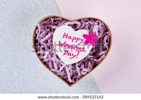 Heart-shaped box and greeting. Best wishes for best woman.