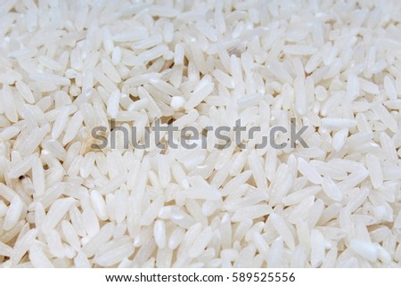Rice background. Rice texture basmati long pattern, white raw uncooked rice closeup