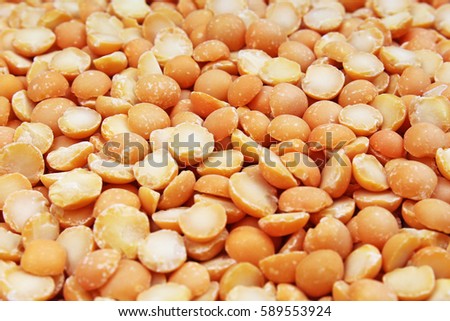 A background of split yellow peas. Yellow peas texture background pattern wallpaper. Healthy food. Studio photo texture photography

