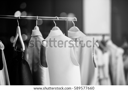 Fashionable clothes in a boutique store in London. Royalty-Free Stock Photo #589577660