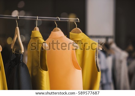 Fashionable clothes in a boutique store in London. Royalty-Free Stock Photo #589577687