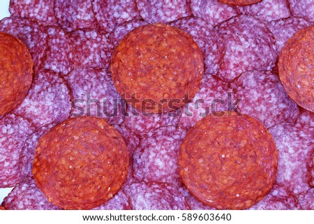 Meat background. Salami background. Red meat pig salami pattern texture.