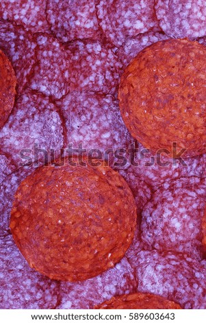 Meat background. Salami background. Red meat pig salami pattern texture.