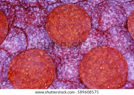 Meat texture. Pig meat salami.  Meat background. Salami slices.