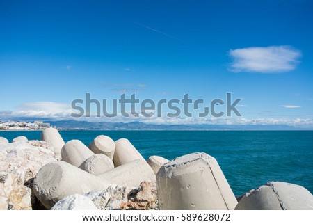 A view to Mediterranean sea and Torremolinos from a pier at Benalmadena port, Andalusia, Spain.