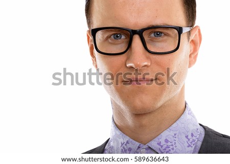 Close up of young handsome businessman wearing eyeglasses