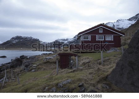 Red fisherman house on the north shore. Photo made in february on the Lofoten islands