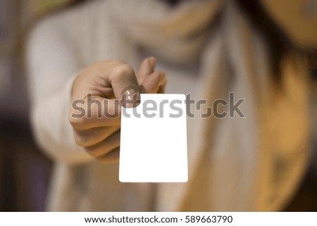 Woman's hand holding blank card