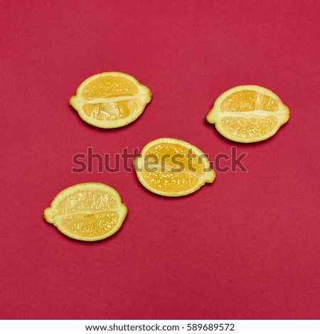 Lemons on red background