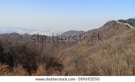 korean mountain castle with city view