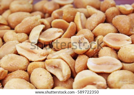 Peeled peanuts background food photography in studio. Close up macro peanuts photo. Beautiful salted roasted peanuts pattern concept.
