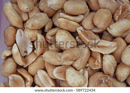 Peeled peanuts background food photography in studio. Close up macro peanuts photo. Beautiful salted roasted peanuts pattern concept.
