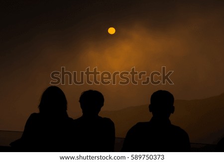 Traveler people enjoying the advanture alternative vacation,Sunset Sky,Watch the beautiful reds and oranges at sunrise or sunset.person,sunrise,silhouette,colours.