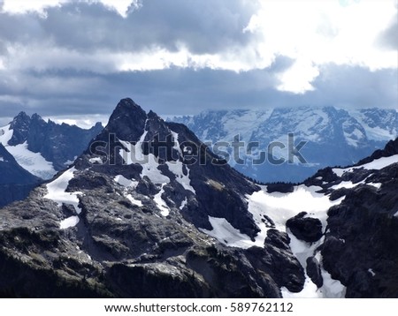 Storm cloud approaching the peak of Goat Mountain in the North Cascades