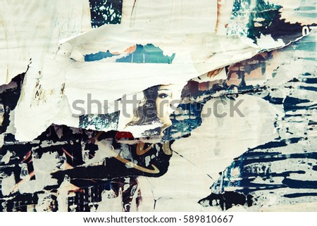 The texture of a wall with torn posters and ads. Bright abstract background ideal for any design
                               