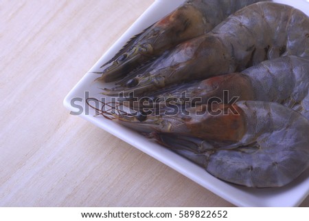 Close up fresh shrimp i, prawn on wooden background