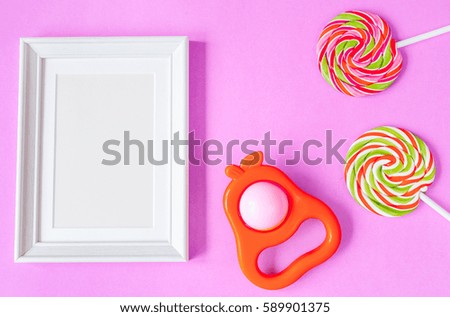 birth of child - blank picture frame on purple background