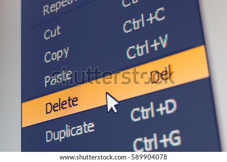 Software menu item with delete command highlighted and mouse cursor selected it, macro shot