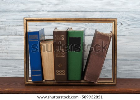 Open book, hardback colorful books on wooden table. Back to school. Copy space for text. Education business concept.Picture