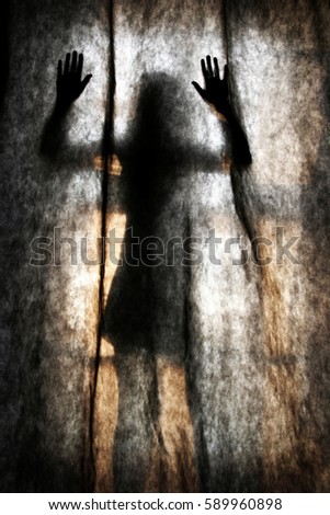 abstract scary human body silhouette woman in the short skirt in front of window behind the black curtain 