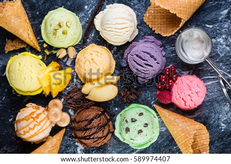 Selection of colorful ice cream scoops on marble background, top view Royalty-Free Stock Photo #589974407