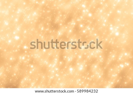 Golden abstract sparkles or glitter lights. Festive gold background. Defocused circles bokeh or particles. Template for design.