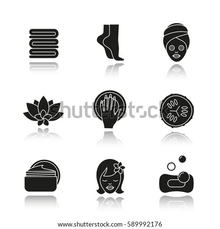 Spa salon drop shadow black icons set. Towels, woman's feet and face, cucumber slice, hand with manicure, cream jar, spa flower. Isolated vector illustrations