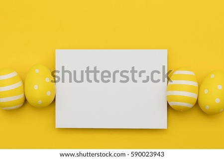 Easter holiday yellow decorated eggs with blank poster