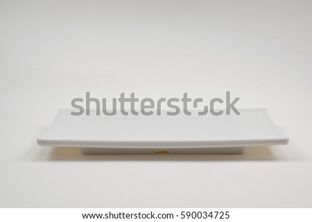 White rectangular plate on white background.